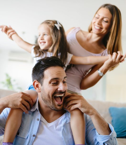 Happy family having fun times at home together